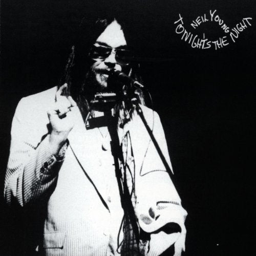 Black and white album cover featuring Neil Young singing into a microphone.