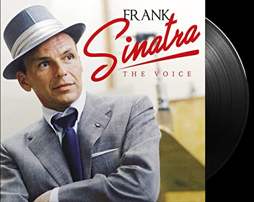 Frank Sinatra in a hat with a vinyl record beside him.