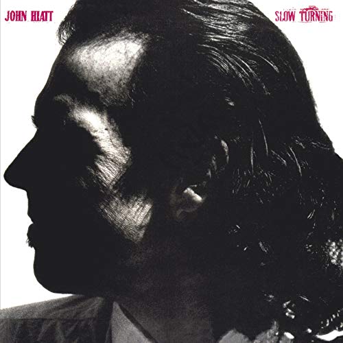 High-contrast black and white profile silhouette of John Hiatt against a white background.