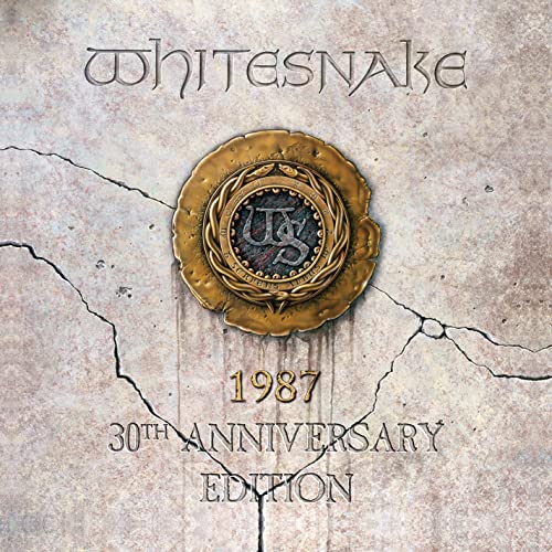 Whitesnake album cover: cracked stone background with gold emblem and text.