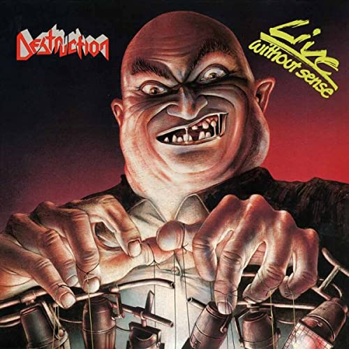 Album cover: distorted face over a drum kit, red background.