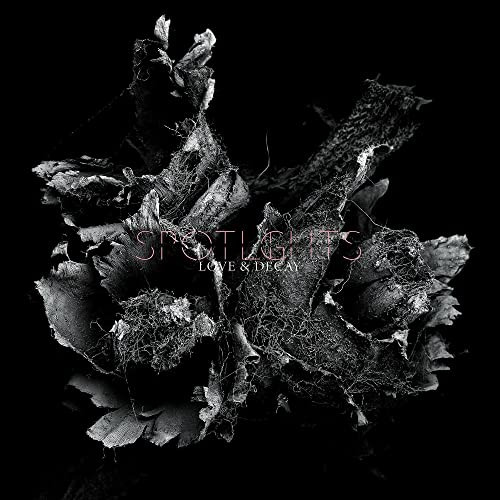 Black and white album cover with decaying floral imagery and text.