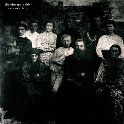 "Vintage black-and-white photograph of a group of people on a vinyl record cover."