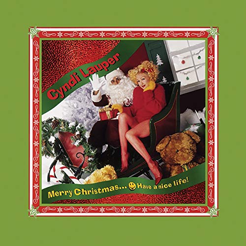 Cyndi Lauper with Santa Claus on a sleigh, album cover art.