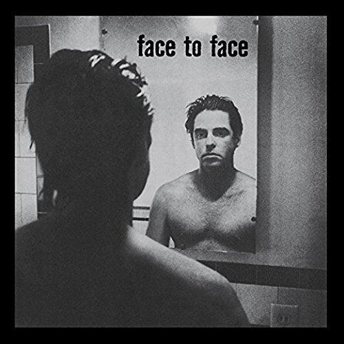 Black and white album cover featuring a man looking in a mirror.