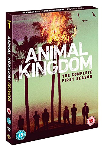DVD cover for "Animal Kingdom" with silhouetted men and a burning palm tree.