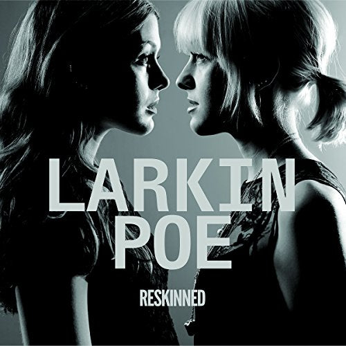 Black and white album cover for Larkin Poe’s “Reskinned,” featuring two women.