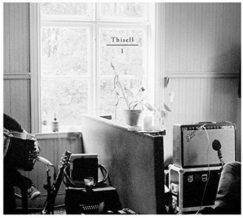 "Black and white album cover with window, desk, and recording equipment."