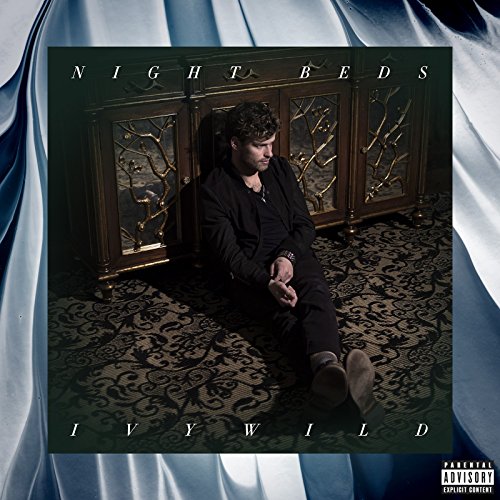 Night Beds’ “Ivywild” CD cover: man seated by ornate wooden cabinet.