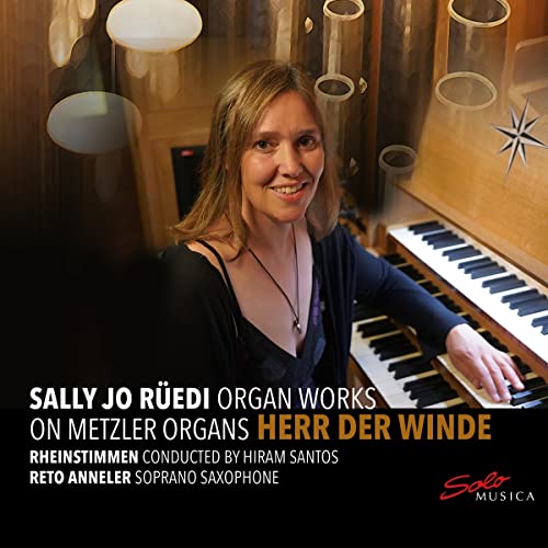 Woman seated at an organ keyboard, album cover for classical music CD.