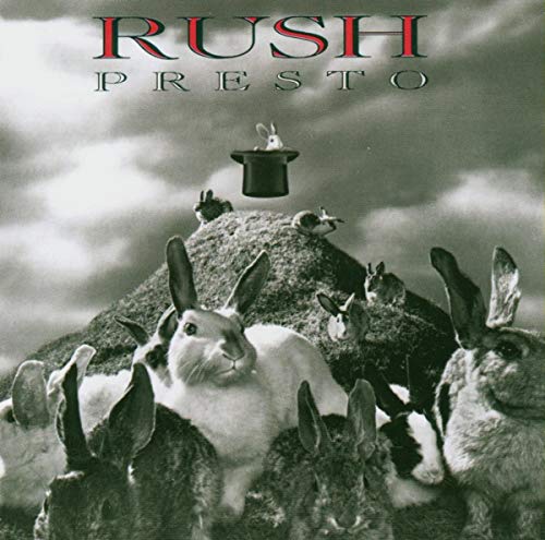 "Album cover featuring multiple rabbits and a top hat on a mound."