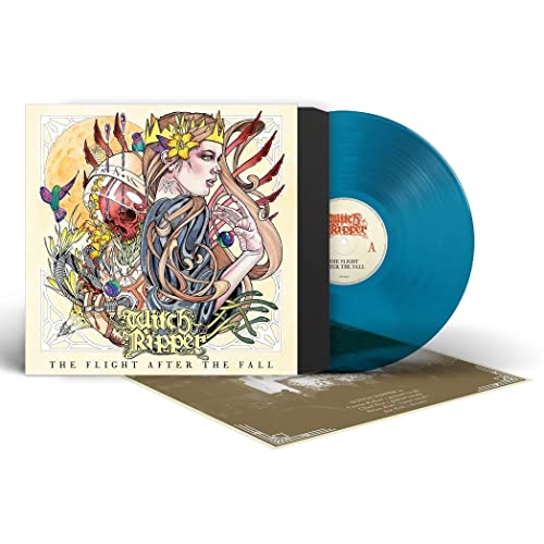 Blue vinyl record with ornate album cover featuring a woman’s portrait.