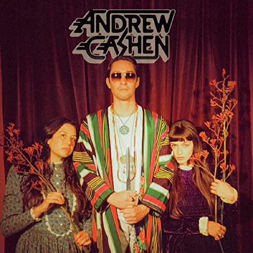 Album cover for Andrew Cashen’s “The Cosmic Silence” featuring three people.