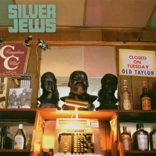 Silver Jews album cover: busts, bottles, and vintage signage on shelves.