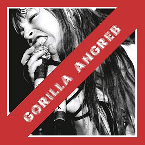 Album cover featuring a black-and-white photo of a woman singing into a microphone.