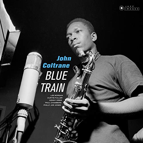 John Coltrane album cover, black and white photo with saxophone and microphone.
