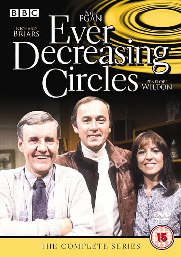 "Ever Decreasing Circles DVD cover featuring three main characters and a yellow spiral design."