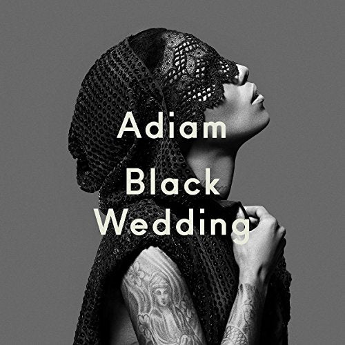 Black and white CD cover featuring a woman in lace and tattoos.