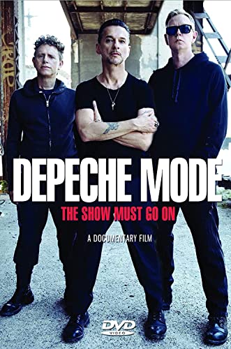 Depeche Mode band members on DVD cover for “The Show Must Go On.”