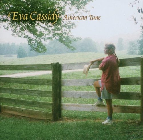 "Eva Cassidy album cover: woman leaning on a wooden fence in a green field."