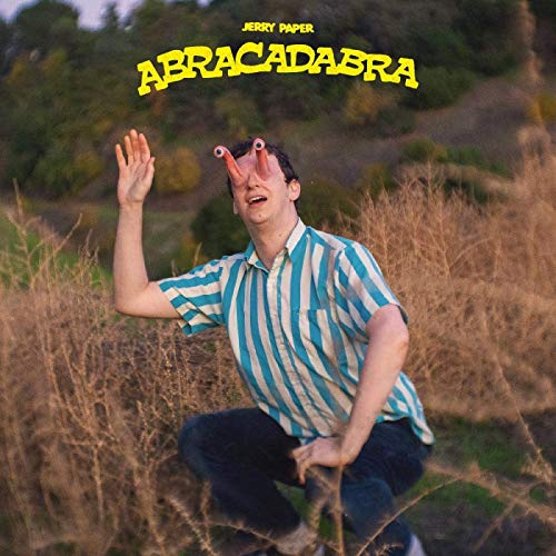 Album cover: man with antennae in striped shirt, outdoor background.