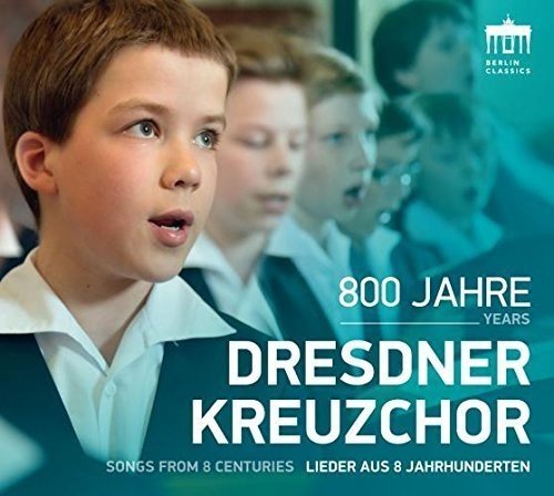CD cover featuring a boy and choir, with white text on a blue background.