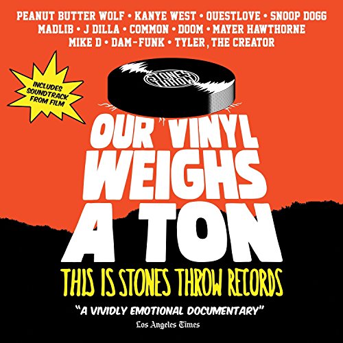 Album cover for "Our Vinyl Weighs A Ton," featuring a vinyl record illustration.