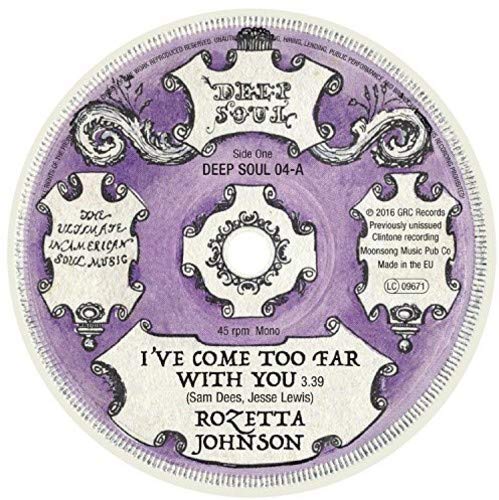 Purple vinyl record label with white ornate design and black text, displaying song and artist.