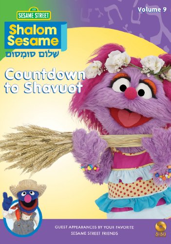 DVD cover featuring a smiling, purple Muppet character wearing a floral crown and holding wheat.
