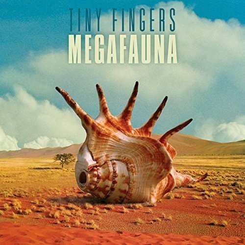 Album cover: large seashell in a desert landscape under clouds.