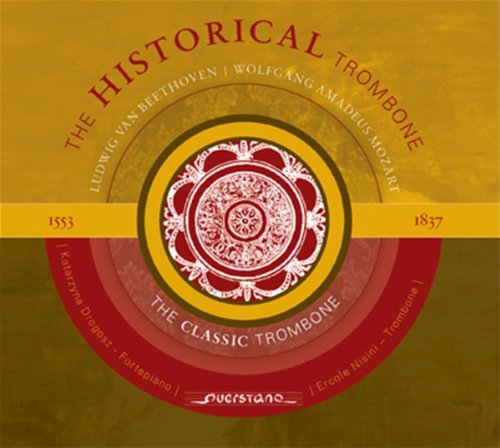"Album cover with red, yellow, and white concentric circles and ornate design."