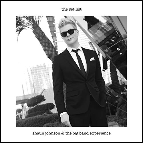 Black and white CD cover featuring Shaun Johnson in a suit and sunglasses.