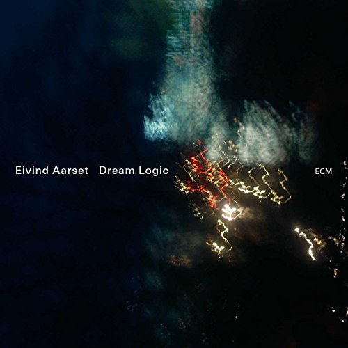 "Eivind Aarset's 'Dream Logic' CD cover, featuring an aerial view of a lit, winding road."