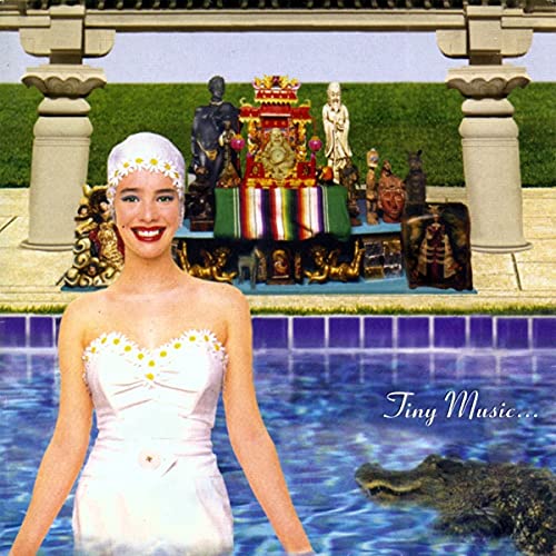 Stone Temple Pilots vinyl album cover with a woman in a pool, records nearby.