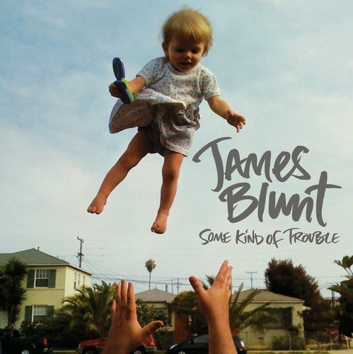 "CD cover art: child being tossed in the air, with 'James Blunt' and 'Some Kind of Trouble'."
