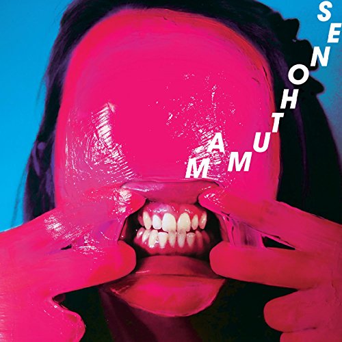 Pink face with distorted features and large text overlay.