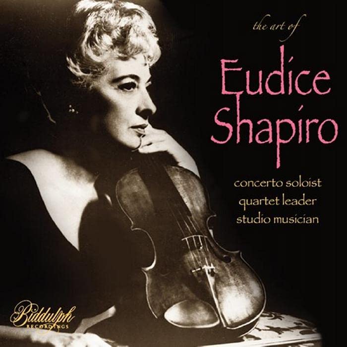 Black and white portrait of violinist Eudice Shapiro with her instrument.