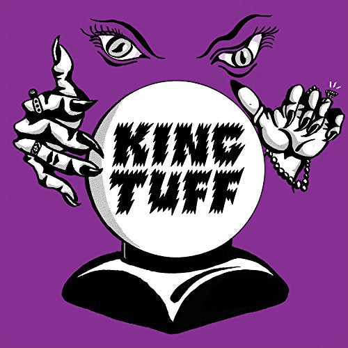 Black and white illustration of hands and a crystal ball with "King Tuff".