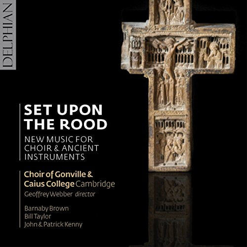 "CD cover featuring an intricately carved stone cross against a black background."