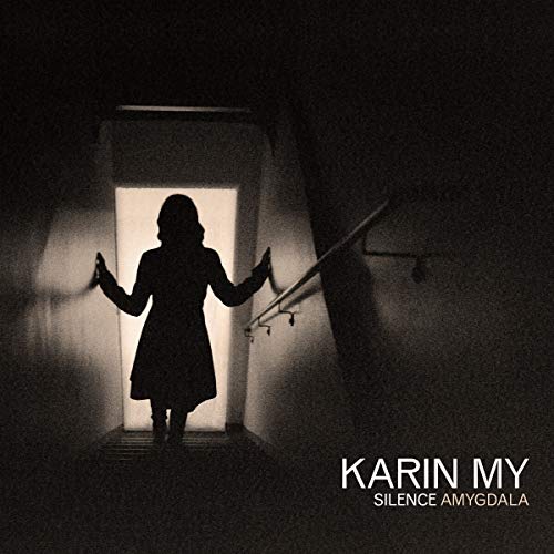 Silhouette of a woman in a doorway, dark and atmospheric album art.