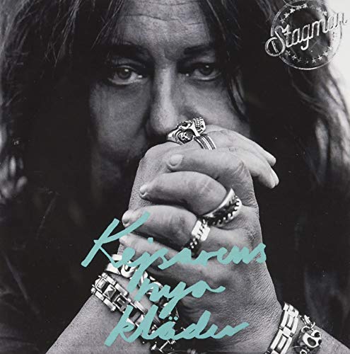 Black and white portrait of a man with rings on his hands.