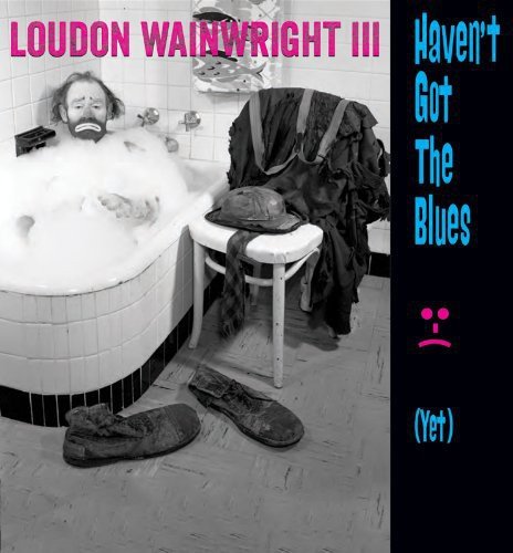 Album cover with man in a bubble bath, shoes and clothes on the floor.