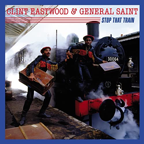 Two men in leather jackets and red hats standing by a steaming steam train.