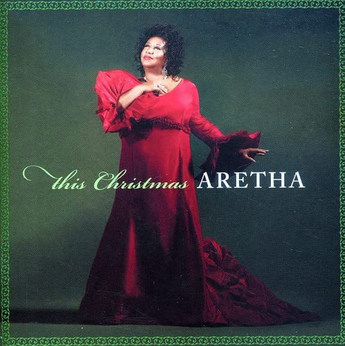 Aretha Franklin in a red dress on the album cover "This Christmas".