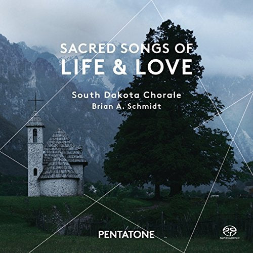 "Album cover with a church and tree in a misty mountain landscape."