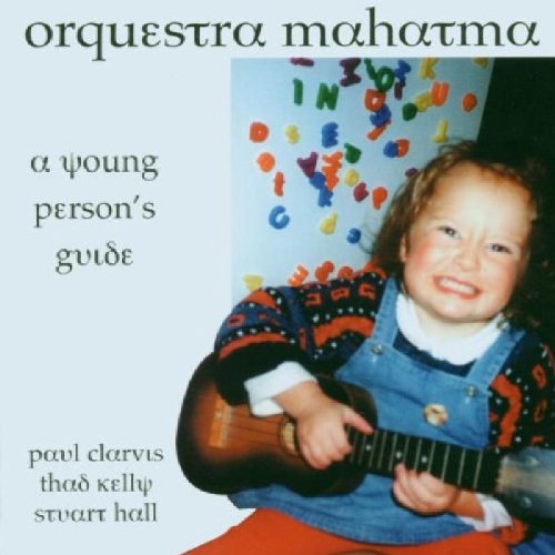 "CD cover featuring a young child holding a guitar, with colorful letters in the background."