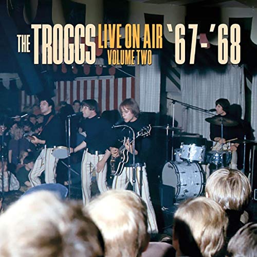 The Troggs band performing live on stage, album cover art.
