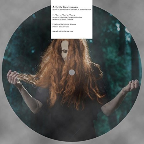 Vinyl record with a woman having long red hair, arms raised, and a white label.