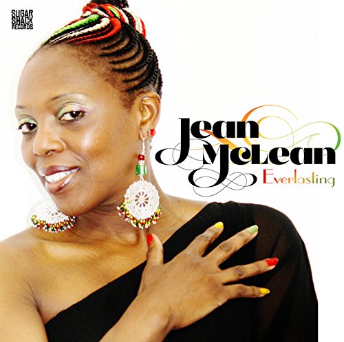 Album cover with a smiling woman wearing colorful braids and large earrings, against a white background.