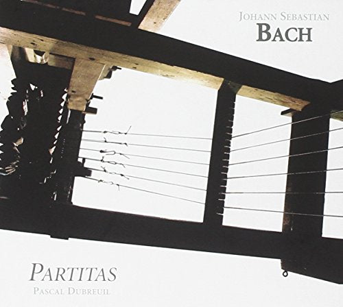 "CD cover featuring a harpsichord's interior with 'Bach' and 'Partitas' text."